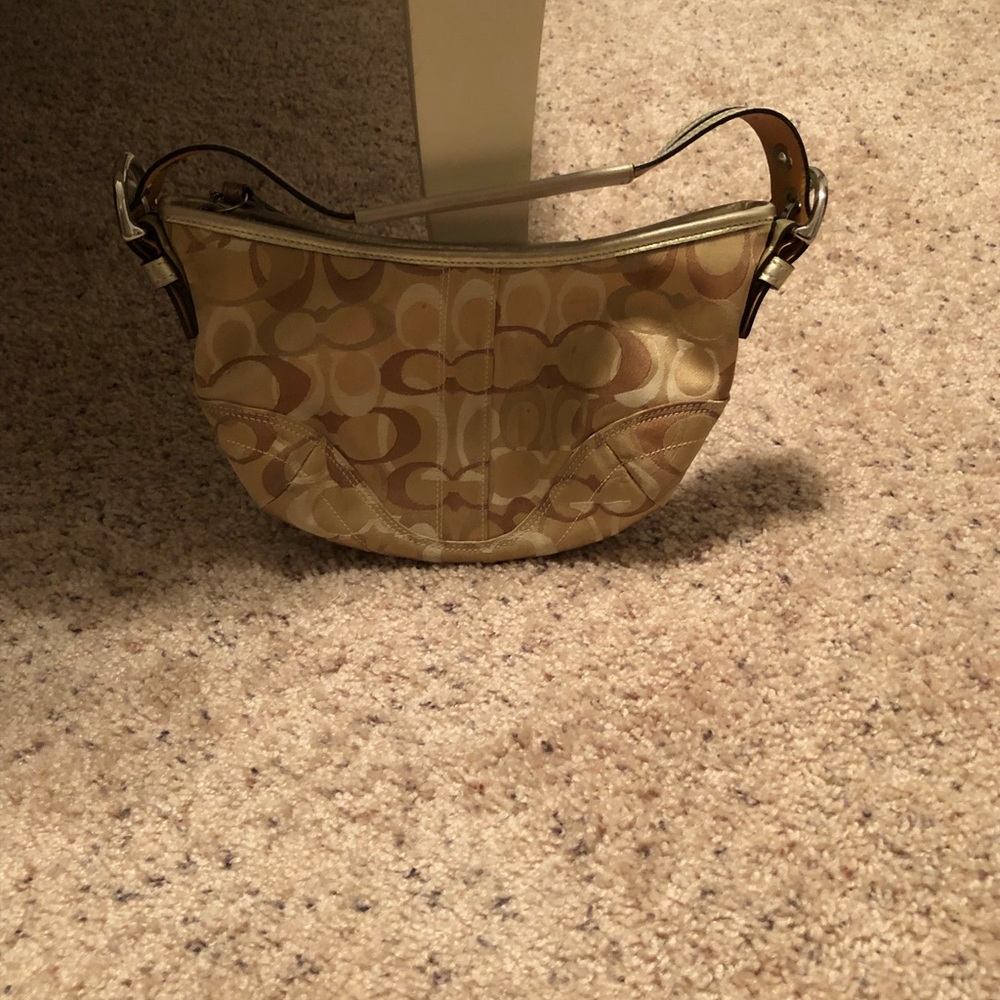 Gold coach purse